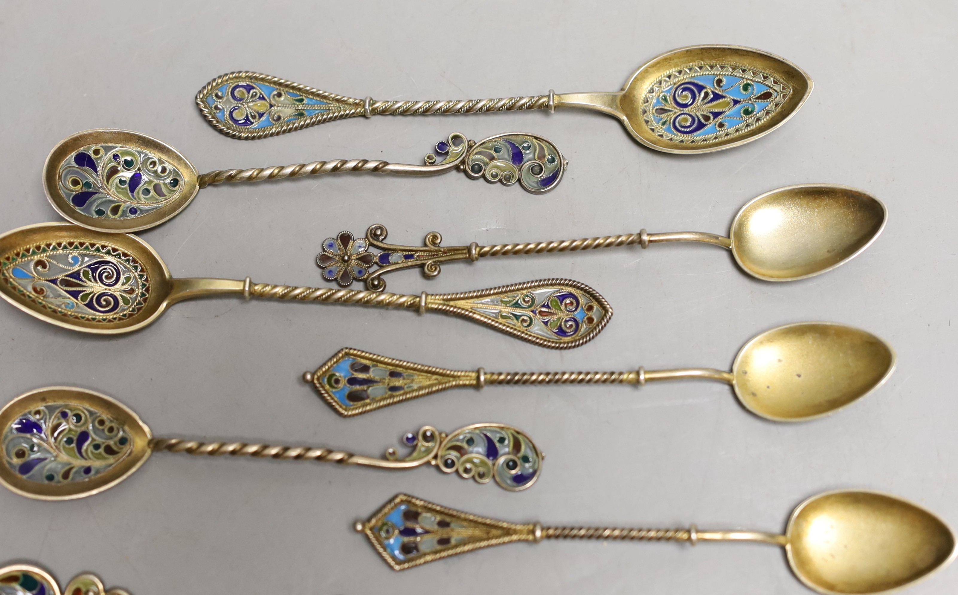 A small collection of eleven assorted Scandinavian gilt white metal and plique a jour small spoons, including four pairs, longest 11.8cm.